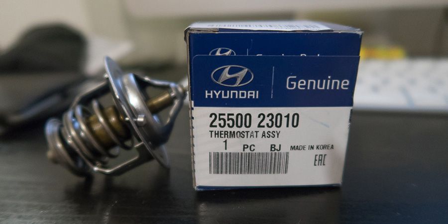 Где находится термостат в Киа Спортейдж